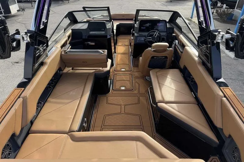 Slide: The Image of 2026 Cobalt R8 Surf boat interior with luxurious tan seating and modern dashboard. - 13