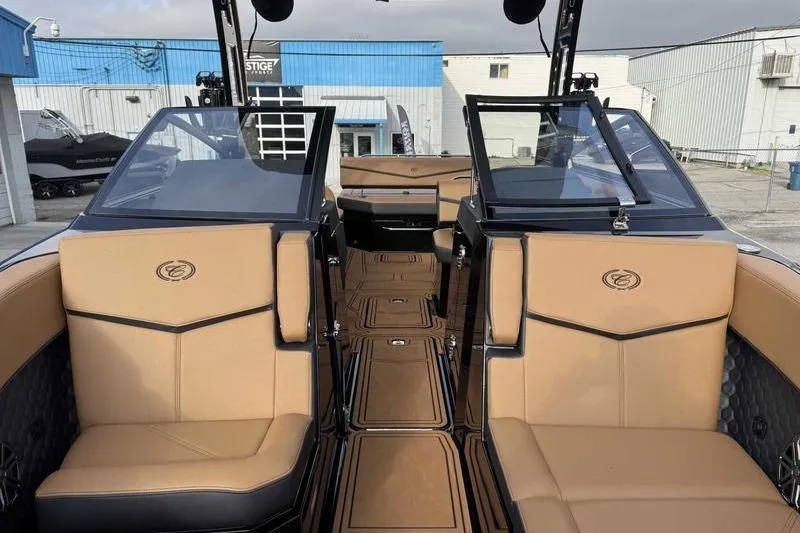 Slide: The Image of 2026 Cobalt R8 Surf boat interior with tan seating and sleek design. - 16
