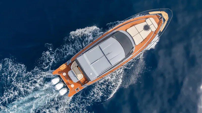 Slide: The Image of Aerial view of 2025 Hanover 415 yacht cruising on blue ocean waters. - 10