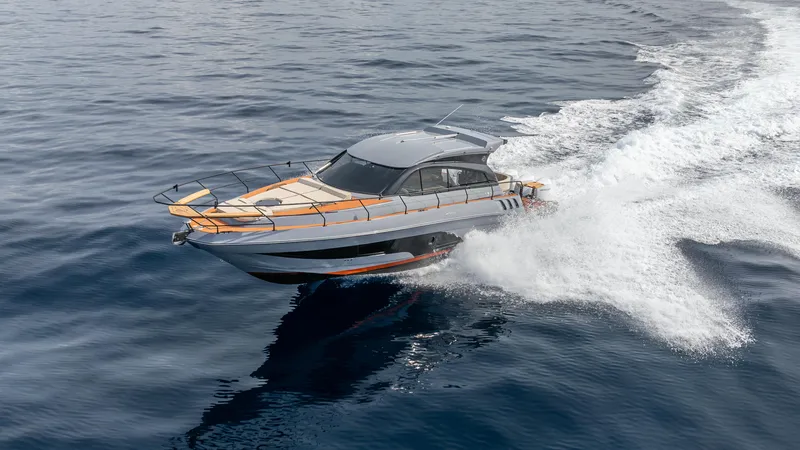 Slide: The Image of 2025 Hanover 415 yacht cruising swiftly on open water. - 20