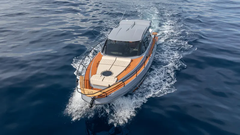 Slide: The Image of 2025 Hanover 415 boat cruising on open water, top view. - 4