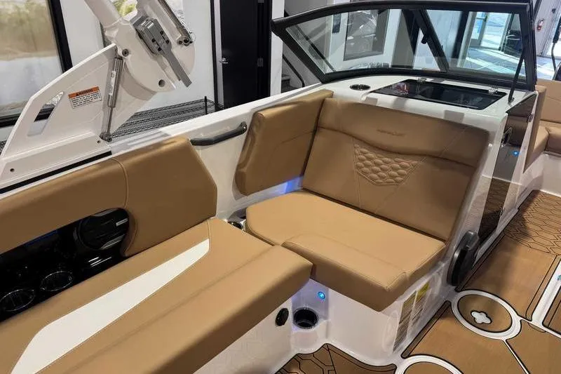 Slide: The Image of 2026 MasterCraft NXT20 boat interior with tan seating and modern design. - 9