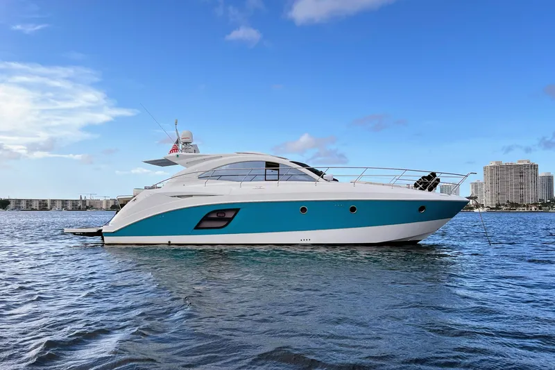 The Image of 2010 Beneteau Monte Carlo 47 yacht on calm water under blue sky. - 1