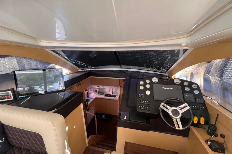 Slide: The Image of Luxury Beneteau Monte Carlo 47 yacht deck with waterfront city view, 2010 model. - 10