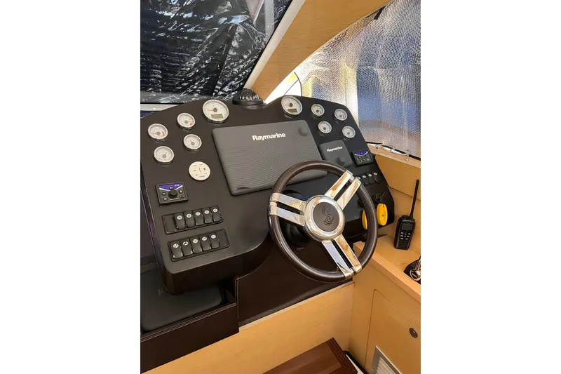 Slide: The Image of Luxury deck of 2010 Beneteau Monte Carlo 47 yacht with scenic water view. - 11