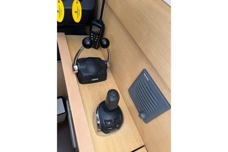 Slide: The Image of Luxurious 2010 Beneteau Monte Carlo 47 yacht with elegant seating and scenic waterfront views. - 12