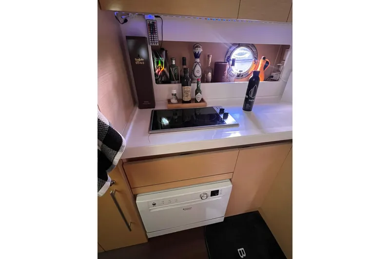 Slide: The Image of Luxurious 2010 Beneteau Monte Carlo 47 yacht deck with seating and ocean view. - 13