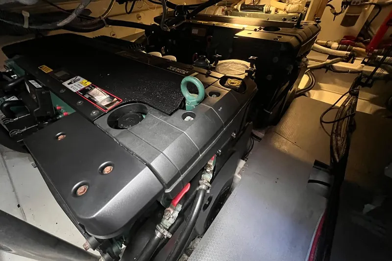 Slide: The Image of Beneteau Monte Carlo 47 yacht with jet ski, 2010 model, on calm water. - 24