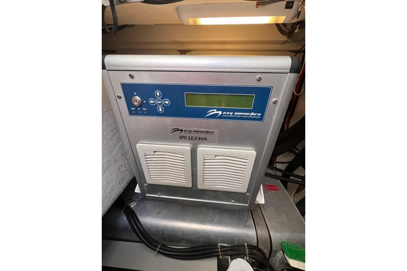 Slide: The Image of Luxurious cabin interior of 2010 Beneteau Monte Carlo 47 yacht, featuring elegant bedding and portholes. - 29