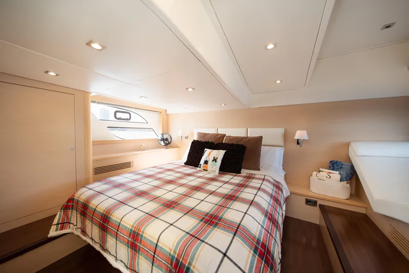Slide: The Image of Luxurious bedroom interior of 2010 Beneteau Monte Carlo 47 yacht with plaid bedding. - 34
