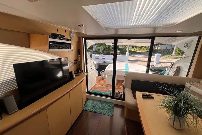 Slide: The Image of 2010 Beneteau Monte Carlo 47 yacht with jet ski, cruising near city skyline. - 8