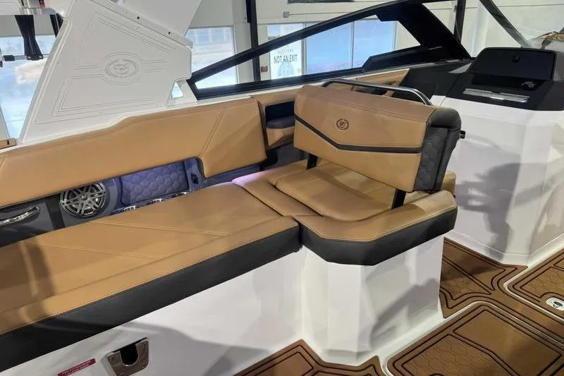 Slide: The Image of 2026 Cobalt R6 Surf boat interior with tan and black seating, modern design. - 10