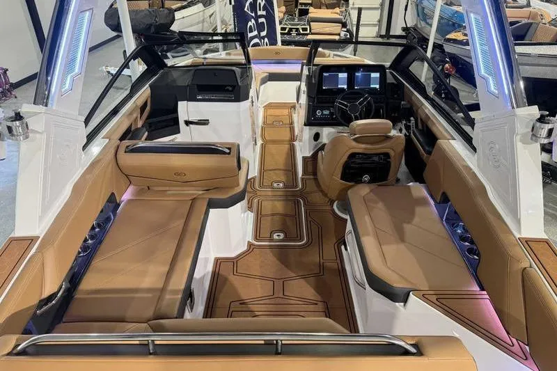 Slide: The Image of 2026 Cobalt R6 Surf boat interior with luxurious tan seating and modern dashboard. - 11