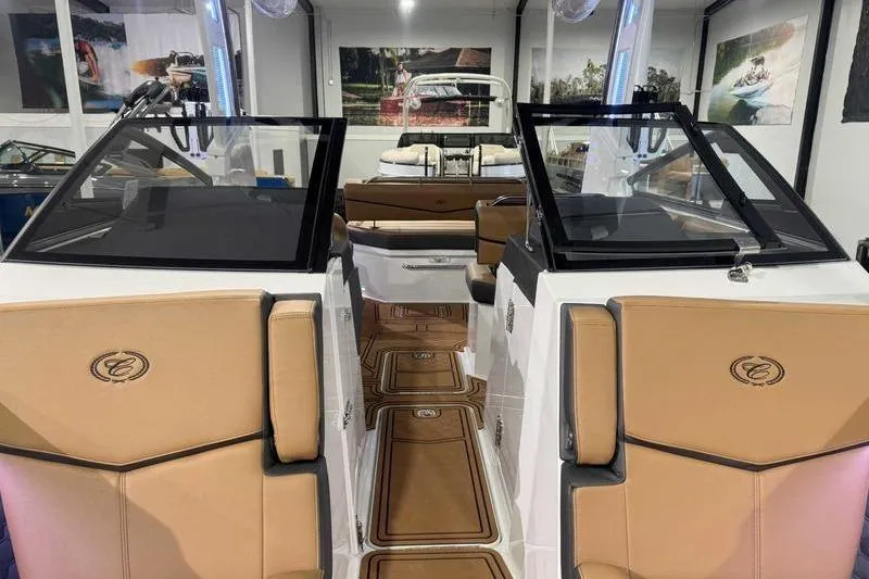 Slide: The Image of 2026 Cobalt R6 Surf boat interior with tan seating and sleek design. - 14