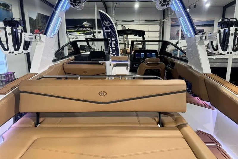 Slide: The Image of 2026 Cobalt R6 Surf boat interior with tan seating and modern dashboard. - 6