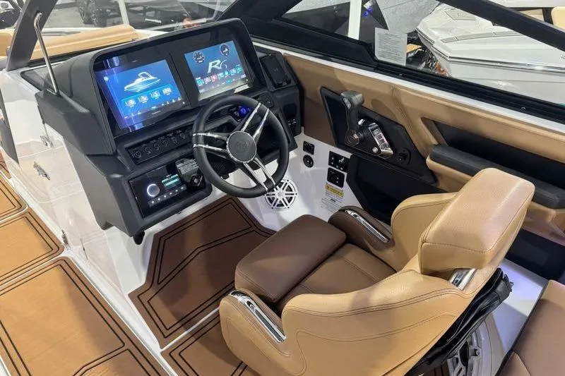 Slide: The Image of 2026 Cobalt R6 Surf boat interior with modern dashboard and luxurious seating. - 8