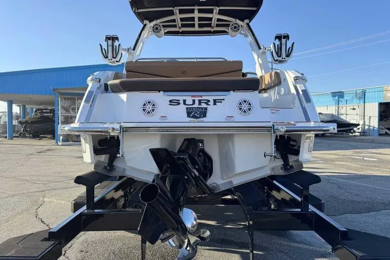 Slide: The Image of 2026 Cobalt R6 Surf boat rear view, showcasing sleek design and powerful engine. - 9