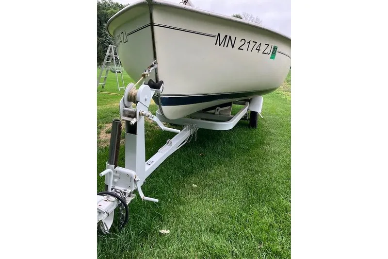 Slide: The Image of 1961 Flying Scot 19 sailboat on trailer, parked on grass. - 7