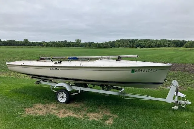 Slide: The Image of 1961 Flying Scot 19 sailboat on trailer, parked on grassy field. - 8
