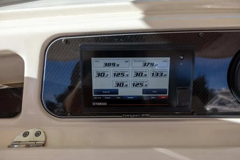 Slide: The Image of Dashboard of 2022 Grady-White Canyon 376 boat displaying trip and fuel data. - 11