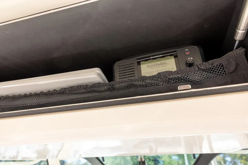 Slide: The Image of 2022 Grady-White Canyon 376 boat with Garmin navigation system in storage compartment. - 13