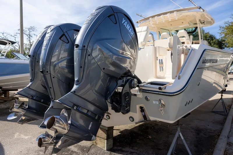 Slide: The Image of 2022 Grady-White Canyon 376 boat with dual Yamaha outboard engines. - 2