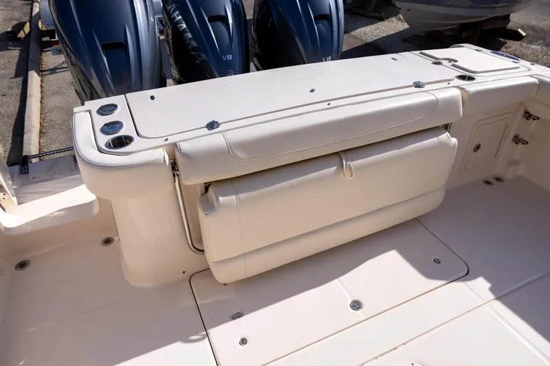 Slide: The Image of 2022 Grady-White Canyon 376 boat deck with seating and Yamaha V8 engines. - 7
