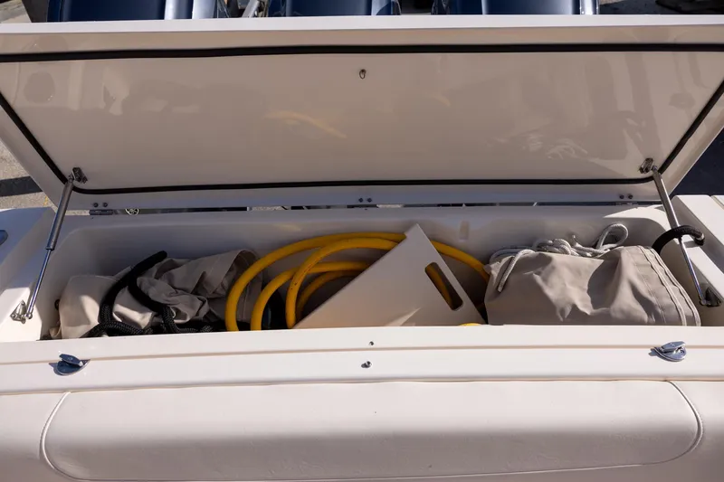 Slide: The Image of Storage compartment of 2022 Grady-White Canyon 376 boat with equipment and supplies. - 8