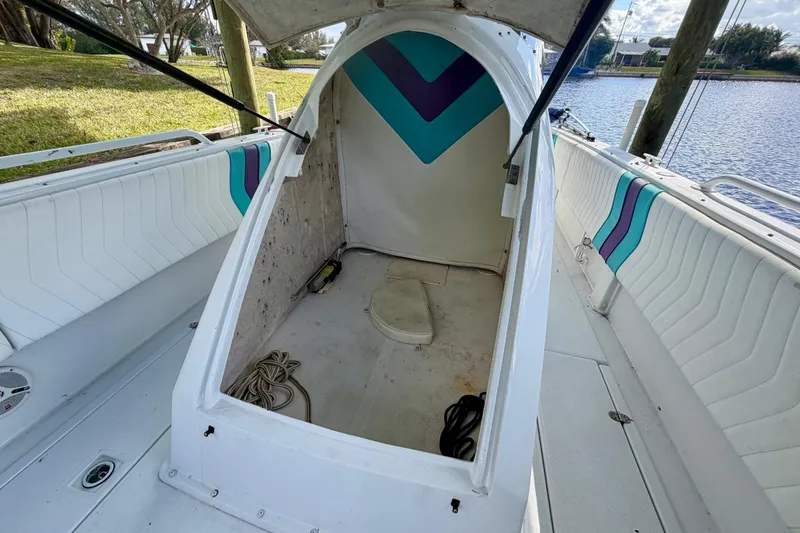 Slide: The Image of 2001 Cobra Predator 3100 boat interior with open cabin and colorful seating. - 23