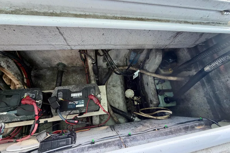 Slide: The Image of Engine compartment of a 2001 Cobra Predator 3100 with visible batteries and wiring. - 29