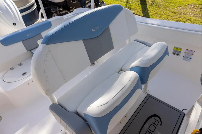 Slide: The Image of 2022 Robalo R242 Explorer boat seating with blue and white upholstery. - 10