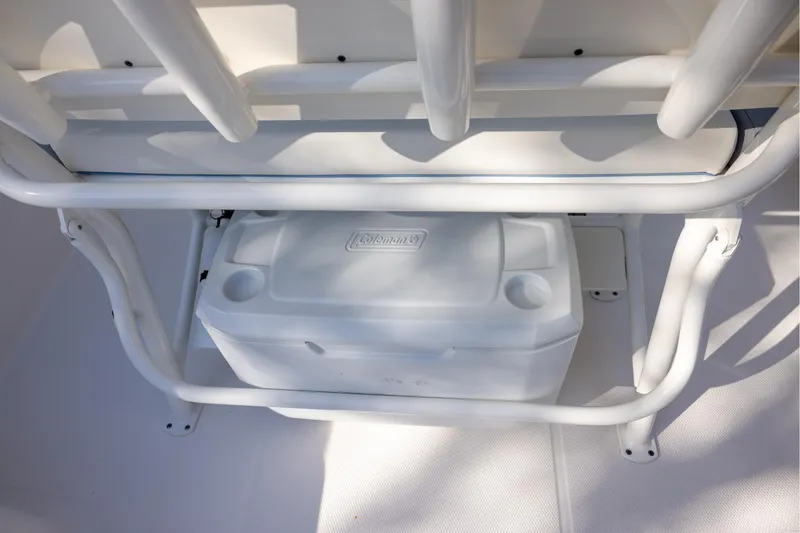 Slide: The Image of 2022 Robalo R242 Explorer boat with integrated cooler storage under seating. - 8