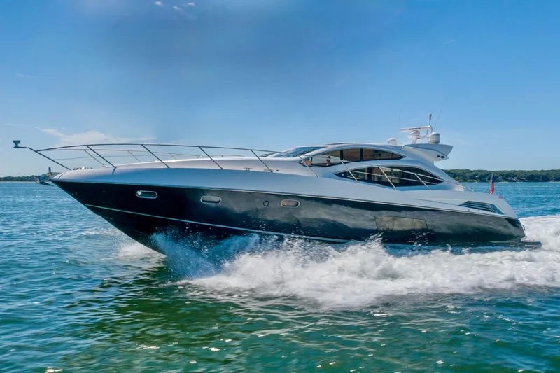 The Image of 2010 Sunseeker Predator 64 yacht cruising on open water under clear blue skies. - 0
