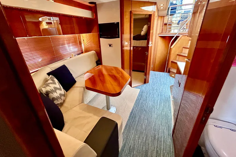 Slide: The Image of Luxurious interior of 2010 Sunseeker Predator 64 yacht with elegant seating and wooden finishes. - 16