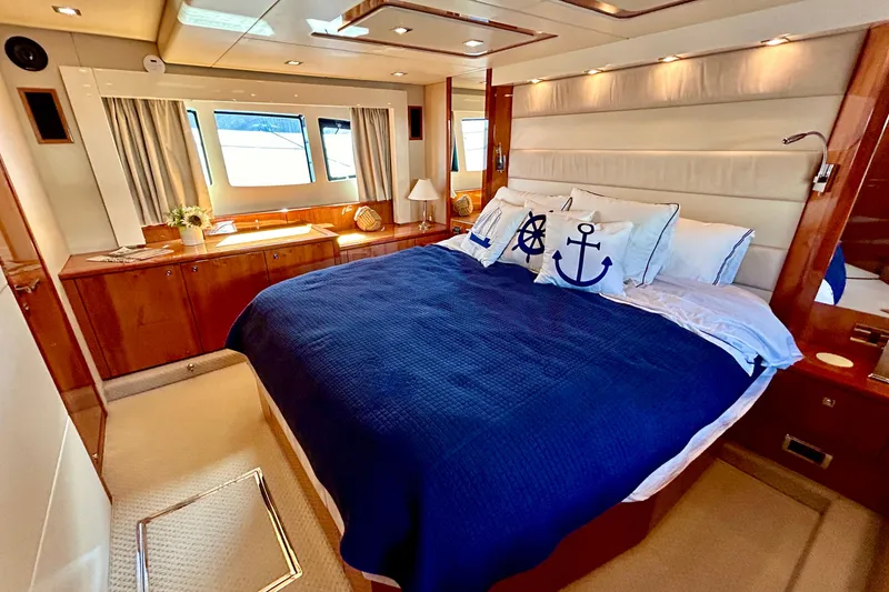 Slide: The Image of Luxurious bedroom interior of 2010 Sunseeker Predator 64 yacht with nautical-themed decor. - 17