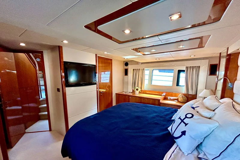 Slide: The Image of Luxurious bedroom interior of 2010 Sunseeker Predator 64 yacht with elegant decor. - 19