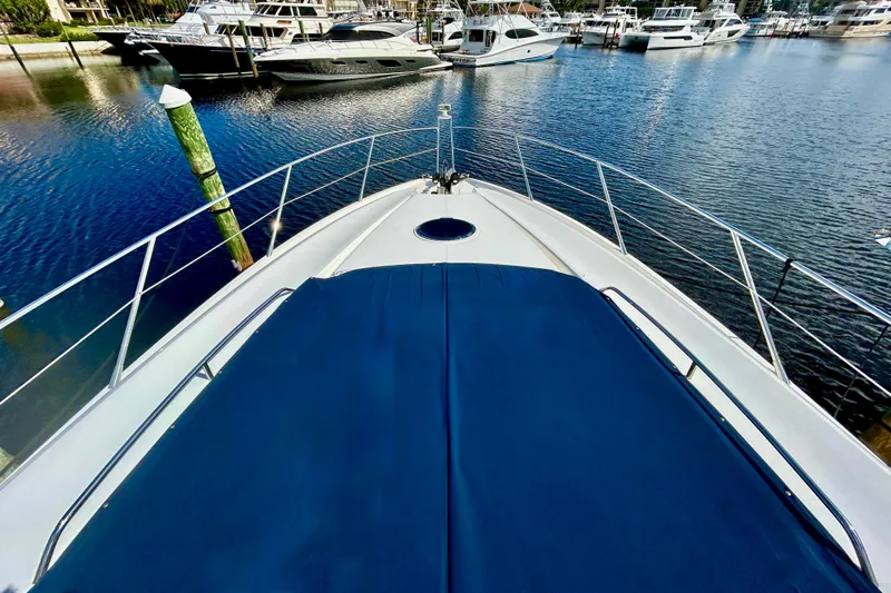 Slide: The Image of Bow view of 2010 Sunseeker Predator 64 yacht docked in a marina. - 2