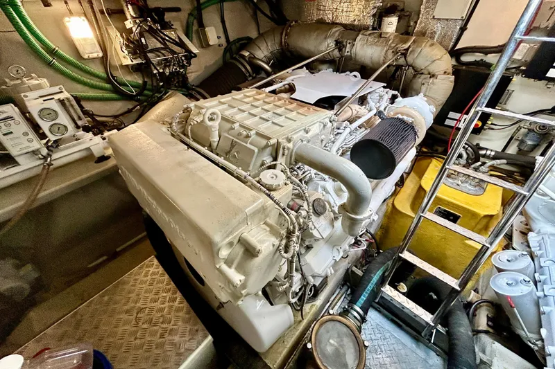 Slide: The Image of Engine room of 2010 Sunseeker Predator 64 yacht, showcasing mechanical components and equipment. - 26