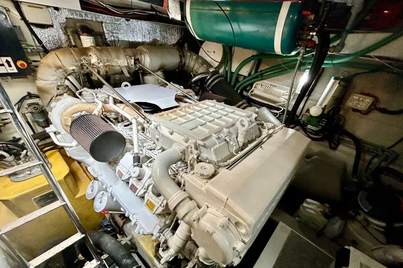 Slide: The Image of Engine room of a 2010 Sunseeker Predator 64 yacht, showcasing mechanical components. - 27