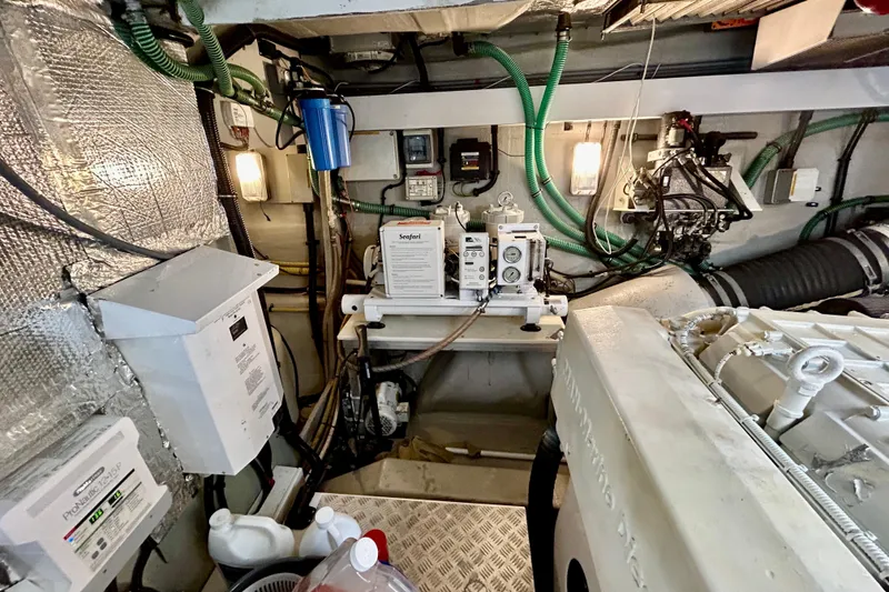 Slide: The Image of Engine room of 2010 Sunseeker Predator 64 yacht with mechanical equipment and wiring. - 29