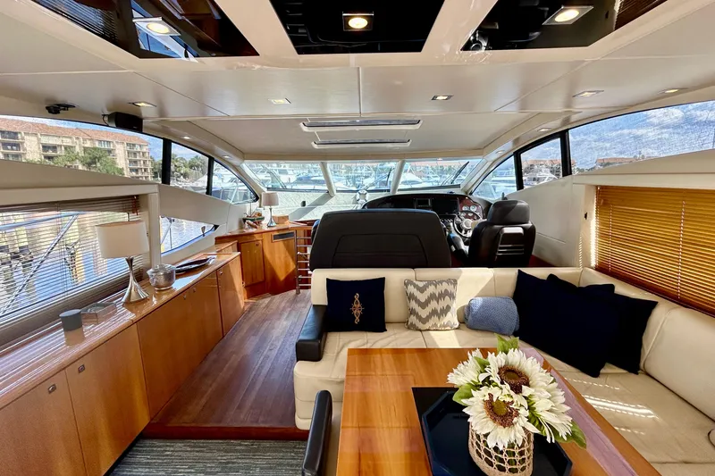 Slide: The Image of Luxurious interior of a 2010 Sunseeker Predator 64 yacht with elegant furnishings and decor. - 6