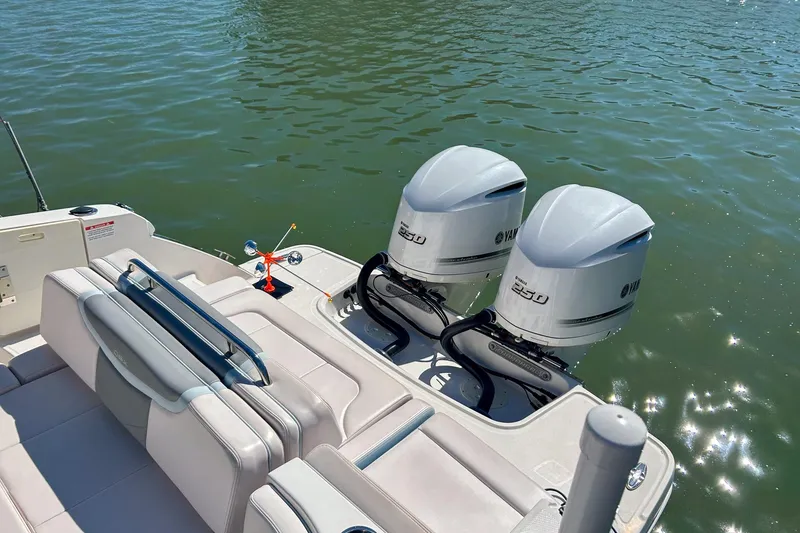 Slide: The Image of 2021 Chaparral 280 OSX boat with twin Yamaha 250 engines on a sunny day. - 17