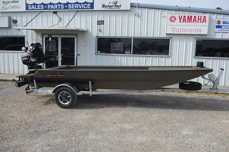 The Image of 2026 Gator Tail 1748 GATOR boat on trailer outside dealership, Yamaha signage visible. - 0