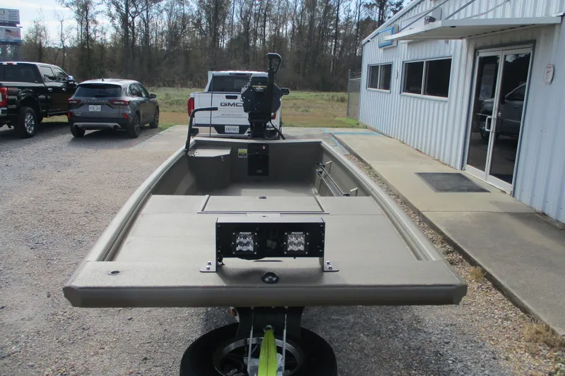 Slide: The Image of 2026 Gator Tail 1748 GATOR boat parked outside dealership, rear view. - 2