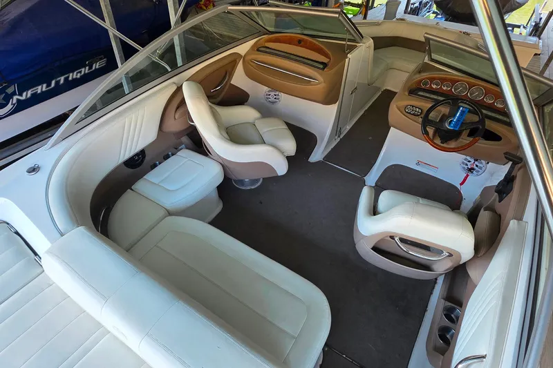 Slide: The Image of Interior of a 2007 Cobalt 212 boat with white and beige seating. - 12
