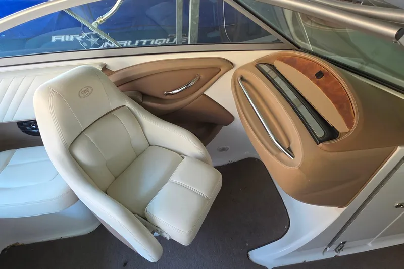 Slide: The Image of 2007 Cobalt 212 boat interior with beige leather seating and sleek design. - 20