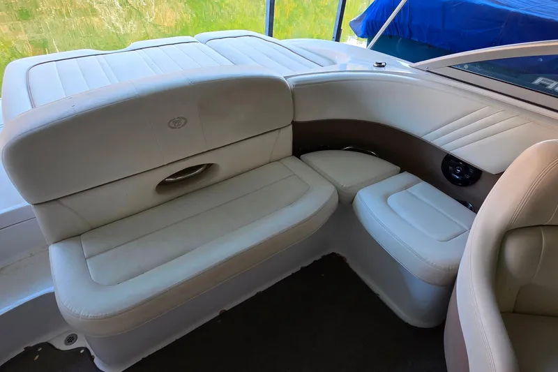 Slide: The Image of Interior seating of a 2007 Cobalt 212 boat with white upholstery. - 22
