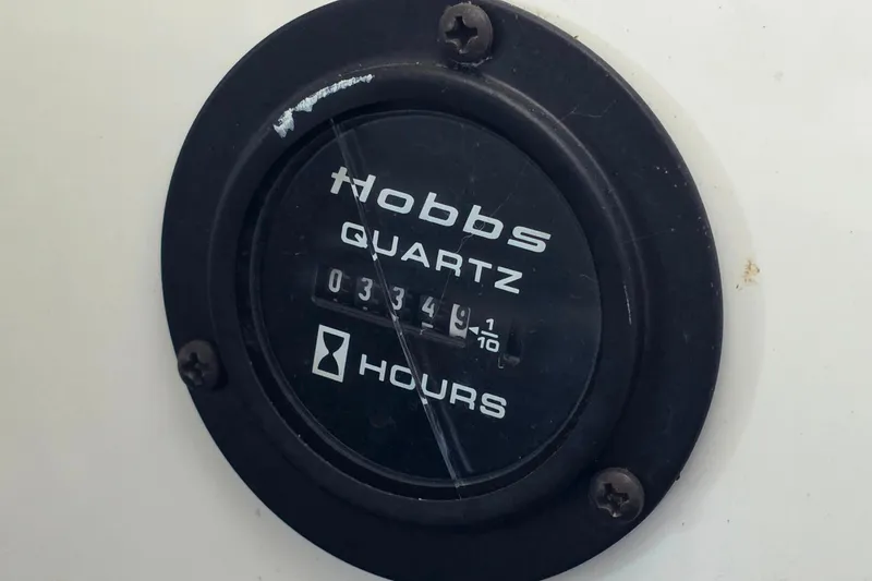 Slide: The Image of Hobbs Quartz hour meter on 2007 Cobalt 212, displaying 334.9 hours. - 27