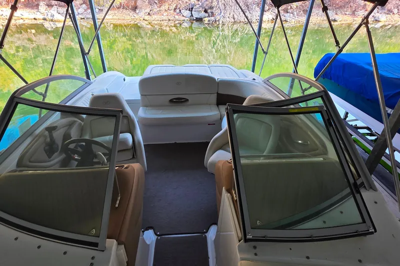 Slide: The Image of Interior of a 2007 Cobalt 212 boat with seating and steering wheel. - 34