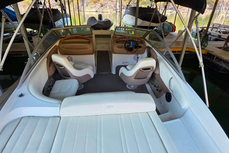 Slide: The Image of Interior of a 2007 Cobalt 212 boat with white and beige seating. - 9